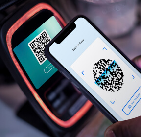 A phone that reads the QR code during payment